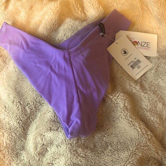 This perfect lilac purple swimsuit bottoms with a cut extra small with tags!!❤️ - Picture 2 of 3